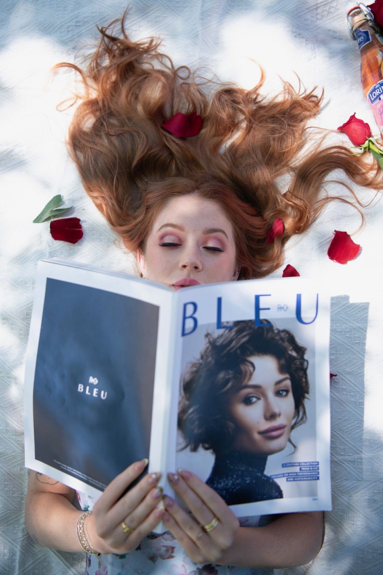 Glossy, voluminous auburn blowout styled at Vamp Salon in Brentwood, CA