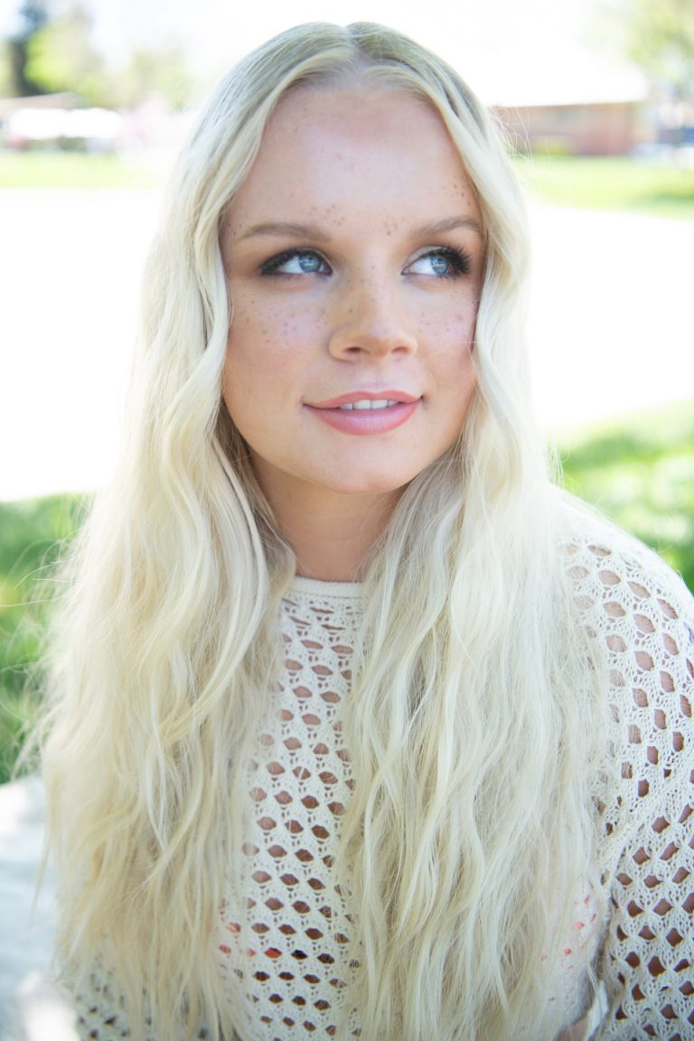 Long, smooth platinum-blonde blowout styled at Vamp Salon in Brentwood, CA