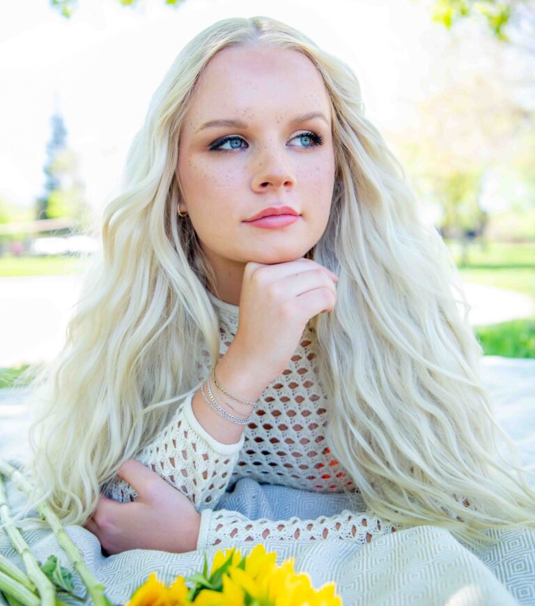 Voluminous, wavy platinum-blonde blowout styled at Vamp Salon in Brentwood, CA