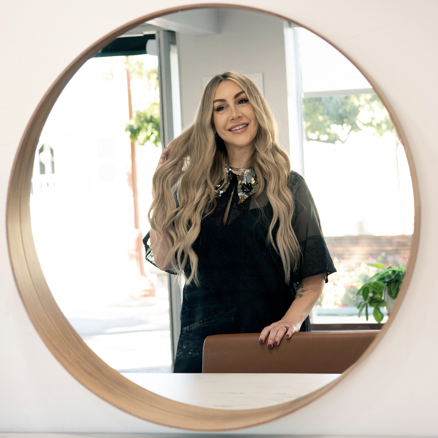 Erika Creston, co-founder of Vamp Salon Extension Studio, hair extension specialist and custom hair color expert.