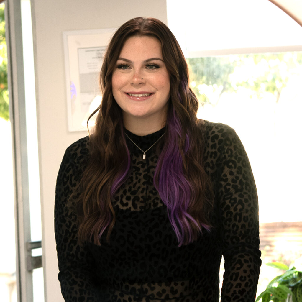 Jewell Crandell, a passionate hairstylist at Vamp Salon, specializing in custom color transformations and trained by Erika and Katie.