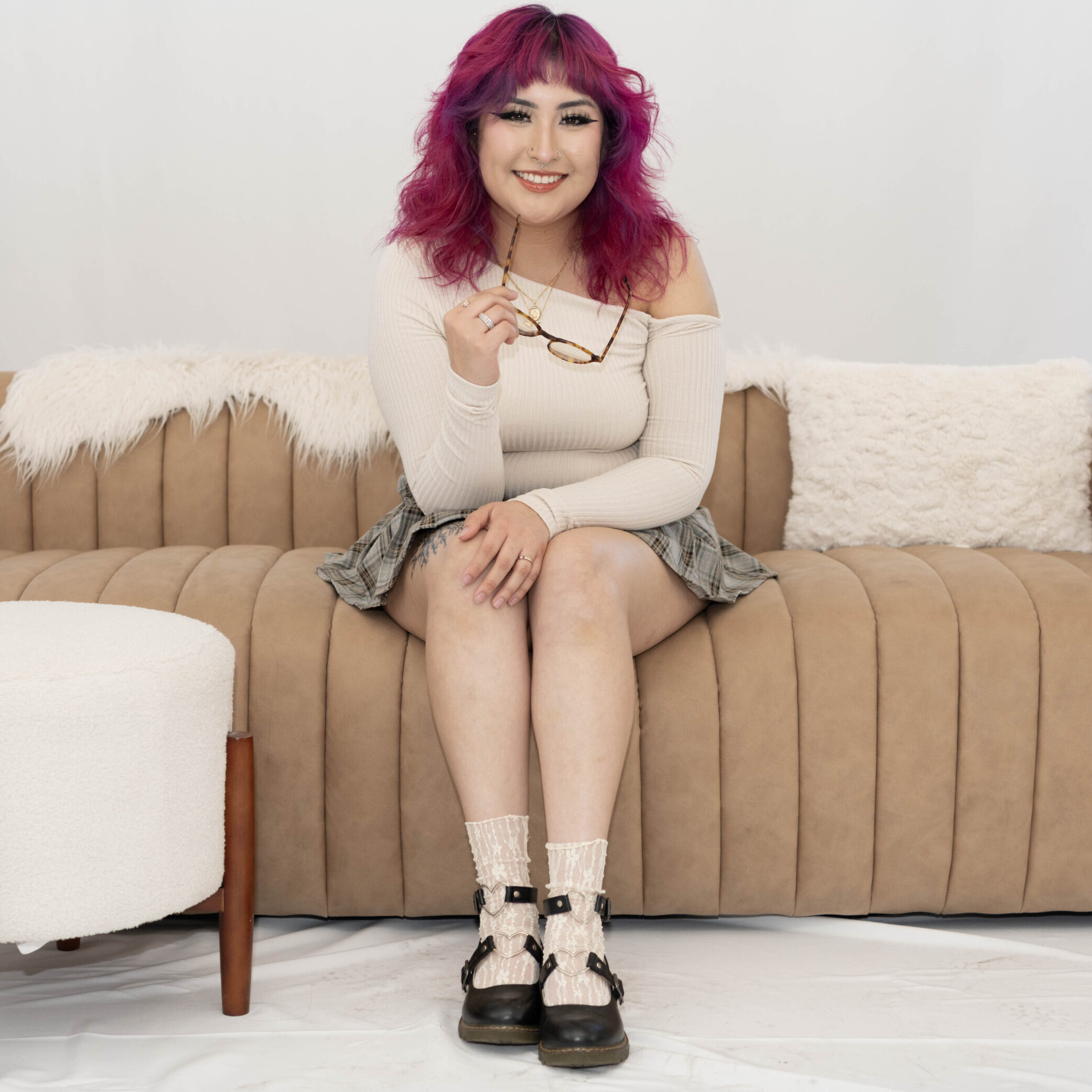 Nayeli Becerra, stylist at Vamp Salon, specializing in trendy haircuts and custom color transformations.