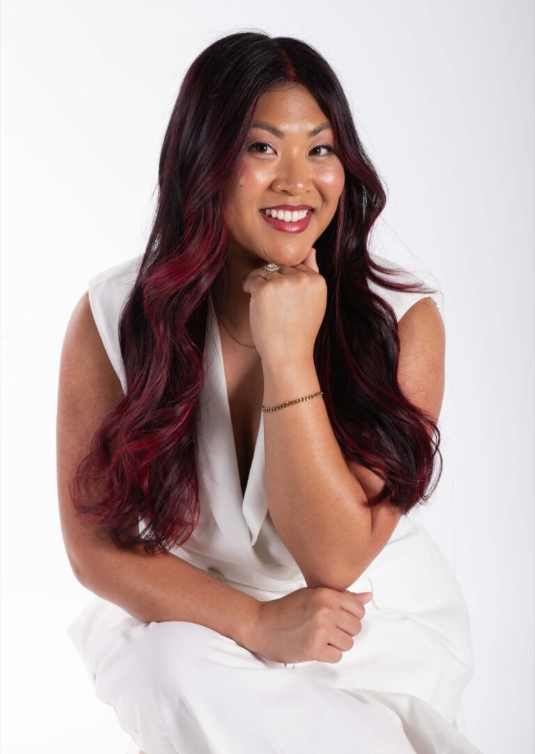 Dimensional cherry-red hair color by Vamp Salon Extension Studio in Brentwood, CA