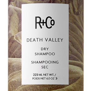 R+Co Death Valley dry shampoo bottle with desert landscape label on the can.