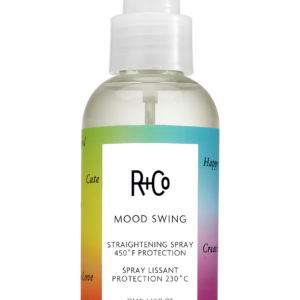 R+Co Mood Swing straightening spray bottle with a rainbow gradient label and white pump cap