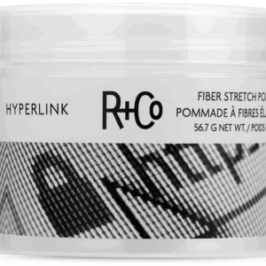 Close-up of a hair product jar labeled R+Co Hyperlink Fiber Stretch Pomade, 56.7 g net wt.
