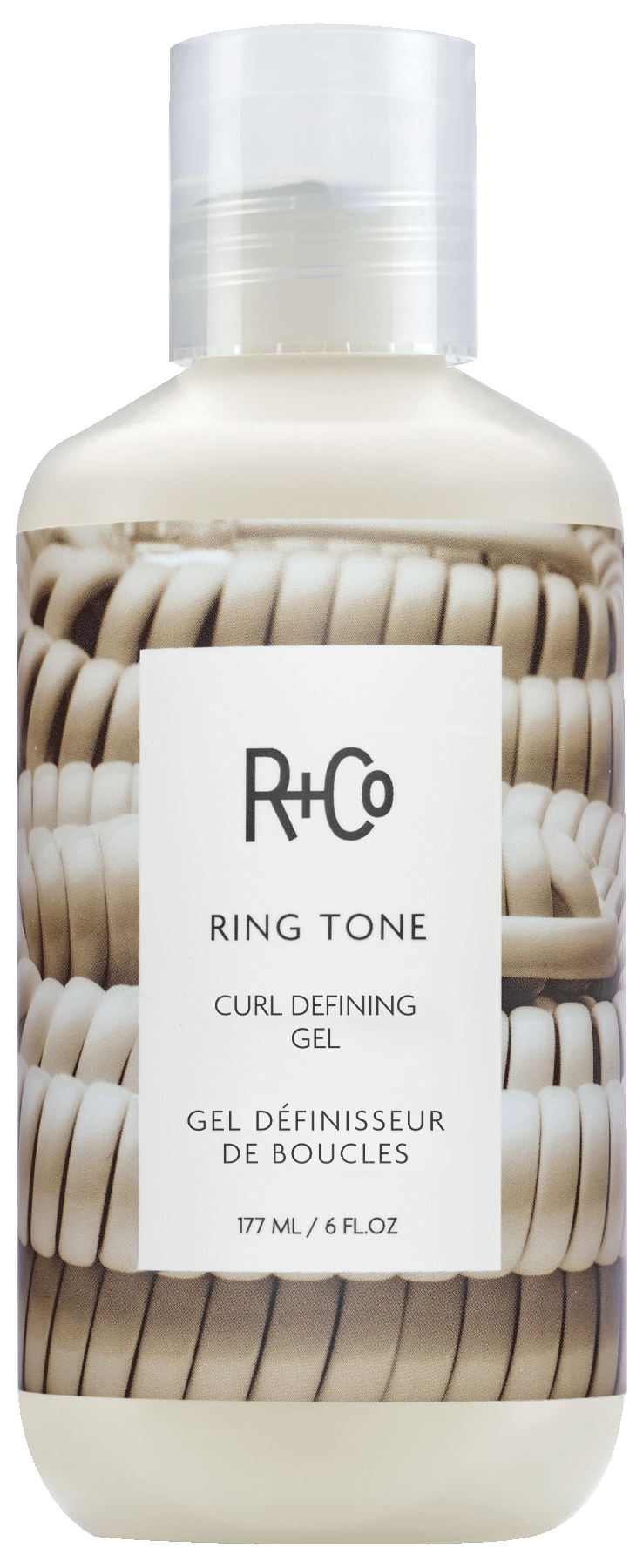 Bottle of R+Co Ring Tone Curl Defining Gel for curls, 177 ml (6 fl oz).